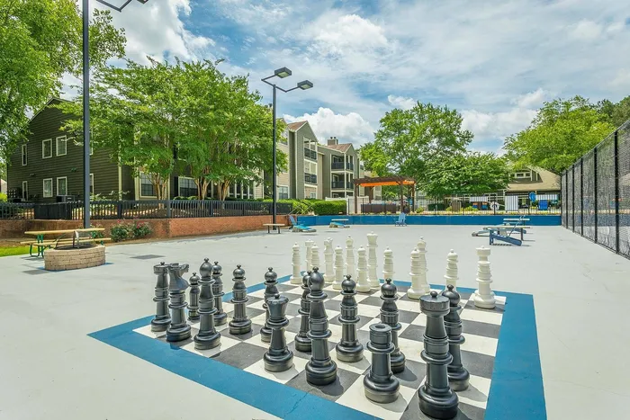 Outdoor multi-sport court with basketball hoops and tennis lines at Avenues of Kennesaw
