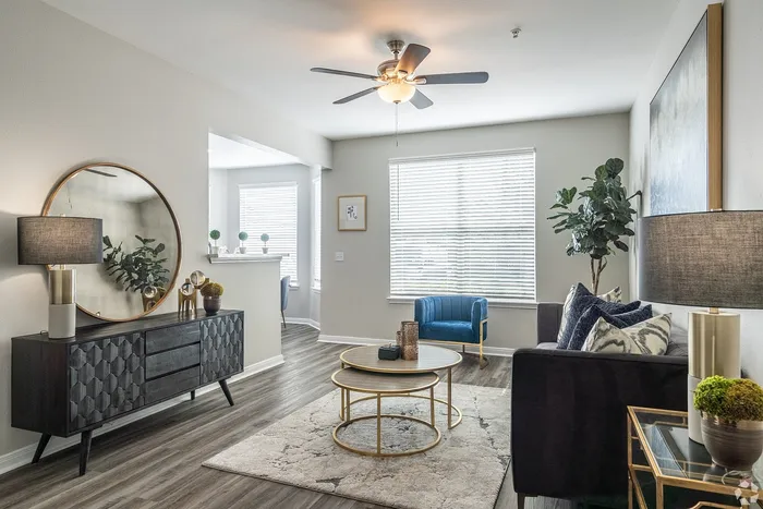 Contemporary living room with accent chair and modern d&eacute;cor at Towne West Apartments