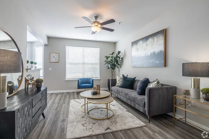 Spacious living room with modern furniture and decor at Towne West Apartments in Houston