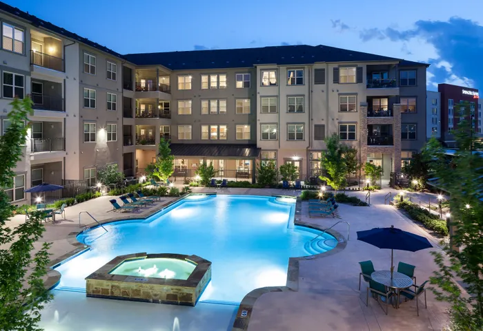 Night view of illuminated pool at McDermott 55