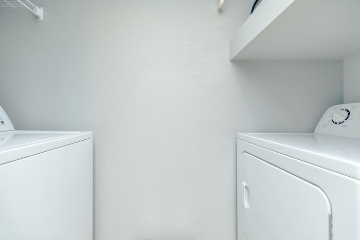 Modern washer and dryer inside a luxury Houston apartment