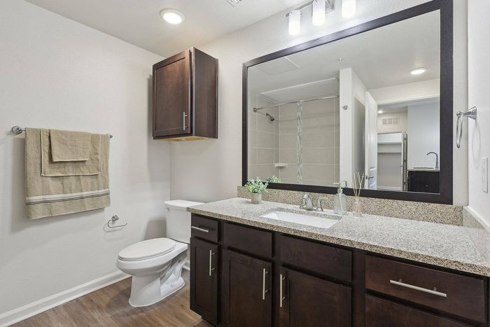 Elegant bathroom featuring a garden tub and walk-in shower in Richmond apartment