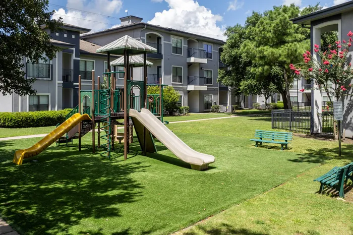 playground with two slides and climbing equipment