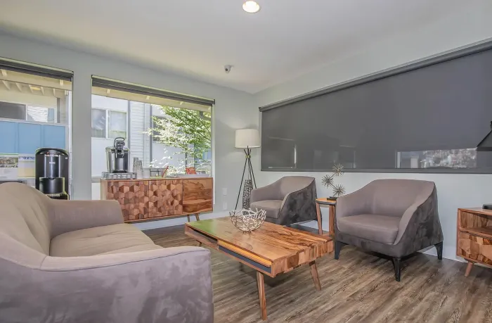 Stylish community room with modern seating at Foster Creek Apartments in Tukwila, WA