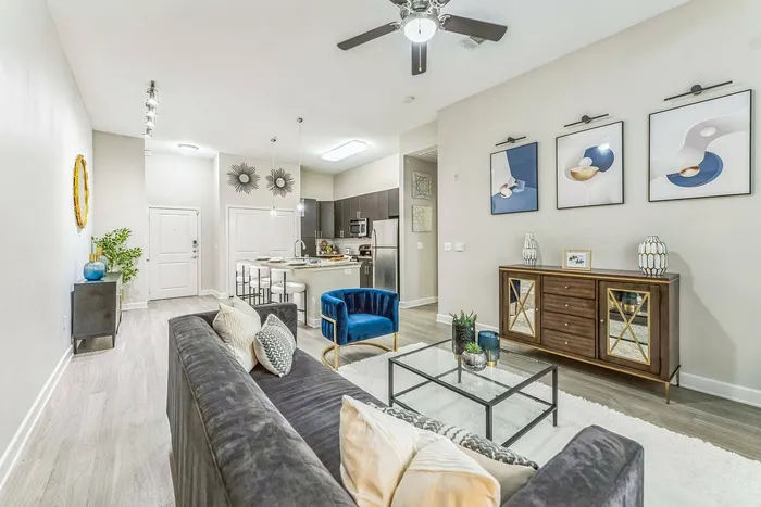 Spacious luxury living room with modern decor at Addison Keller Springs in Addison, Texas