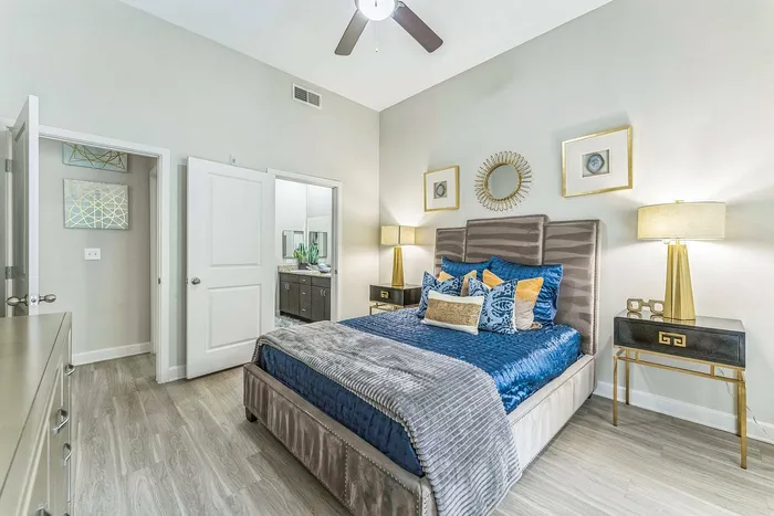 Spacious modern bedroom with large windows at Addison Keller Springs, Addison TX