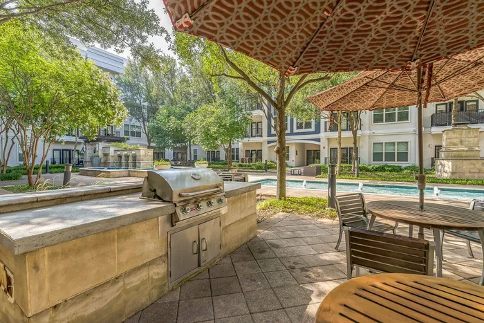 Modern BBQ grilling station at Addison Keller Springs luxury apartments in Addison, Texas