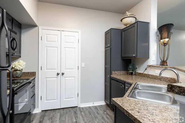 Modern kitchen with stainless steel appliances and granite countertops at Lifestyles Hueco Estates in El Paso, TX.
