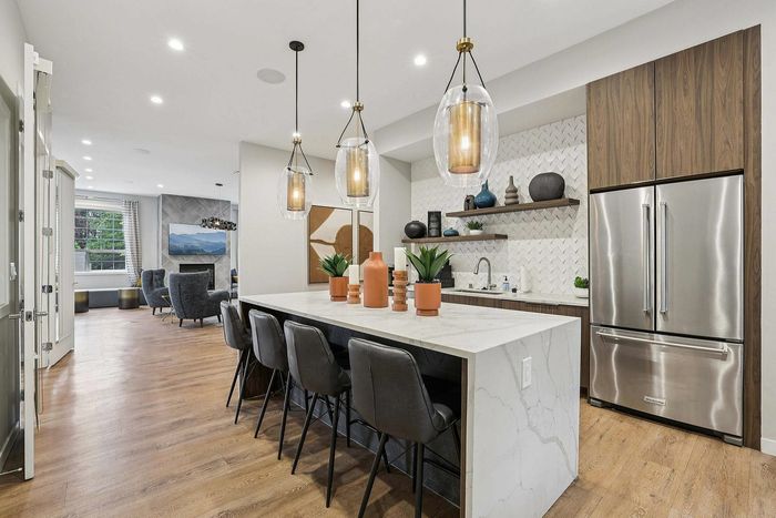 kitchenette with island and entertaining space in the clubhouse at The Ardent