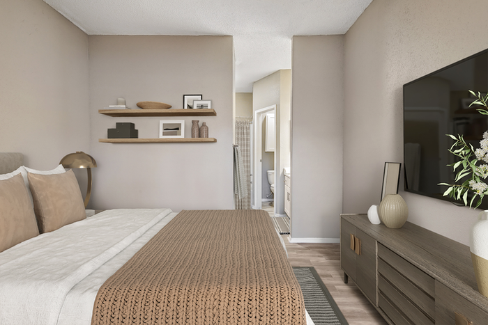bedroom with floating shelves and TV