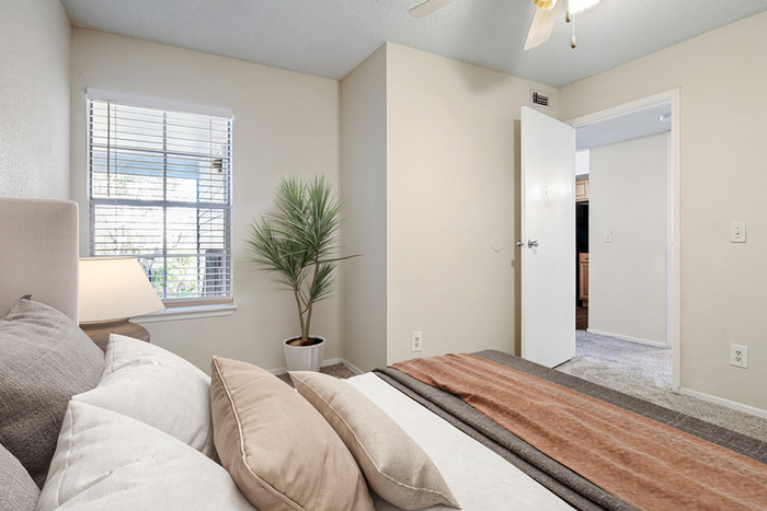 Bed, lamp, and large window
