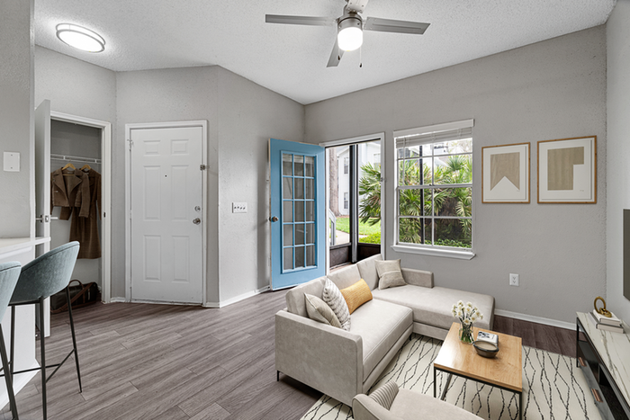 Living room with sectional and ceiling fan