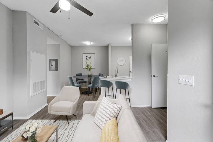 Living room with sectional and ceiling fan