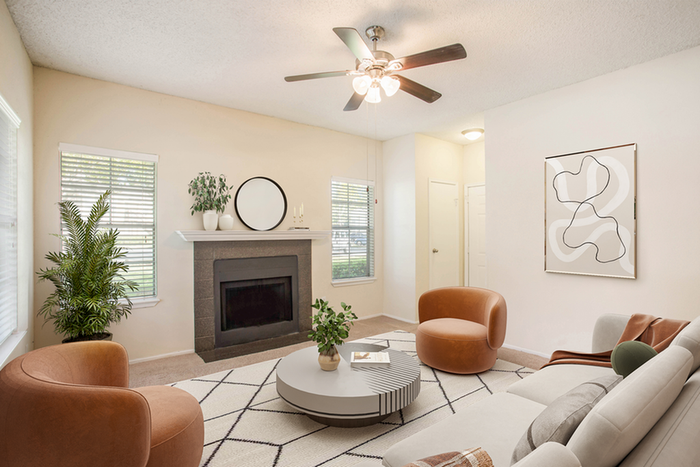 Living room, fire place, and ceiling fan