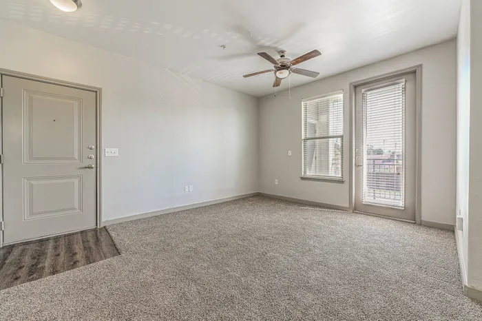 enter into your new home with spacious living area and bright natural light at Encore Crossing