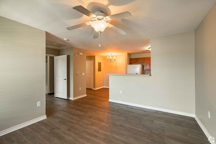 Bright dining area with modern lighting and a spacious layout at Inwood Crossings in Wichita, Kansas.