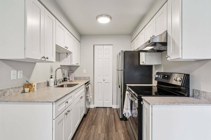 Modern kitchen at Foster Creek Apartments Tukwila WA with stainless steel appliances