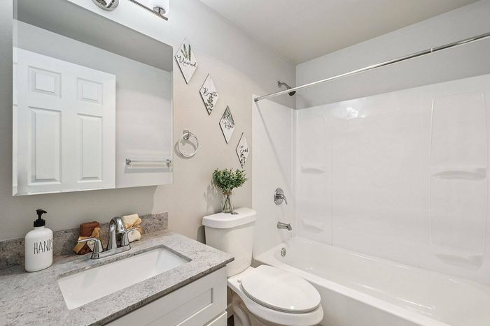 Modern bathroom at Foster Creek Apartments Tukwila WA – sleek vanity, tile shower