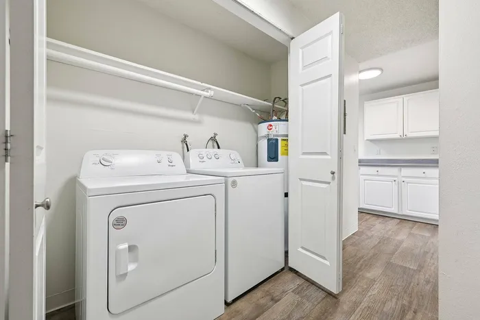 In‑unit washer and dryer inside a Foster Creek apartment in Tukwila WA