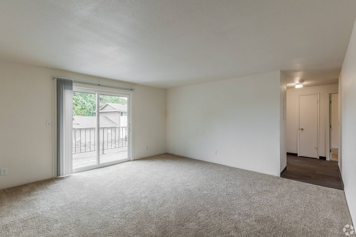 Modern living room at Fox Pointe Apartments in Portland, OR with natural light and open layout