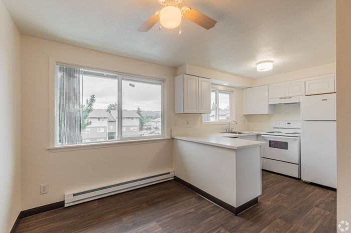 Modern dining room at Fox Pointe Apartments in Portland, OR with natural light