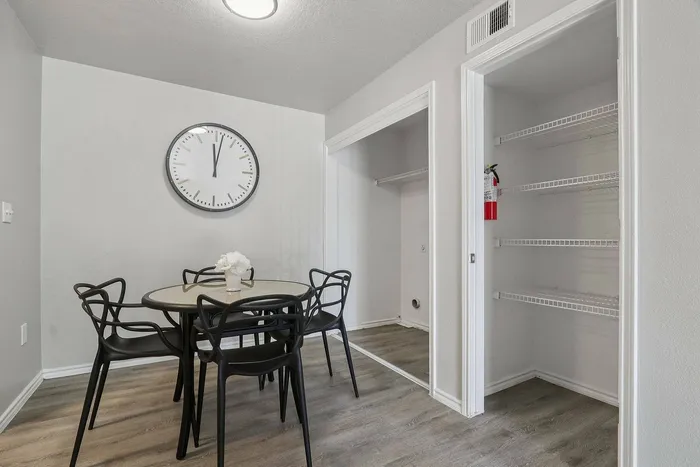 Spacious dining room with contemporary furnishings at Avonmora Apartments in Austin, TX