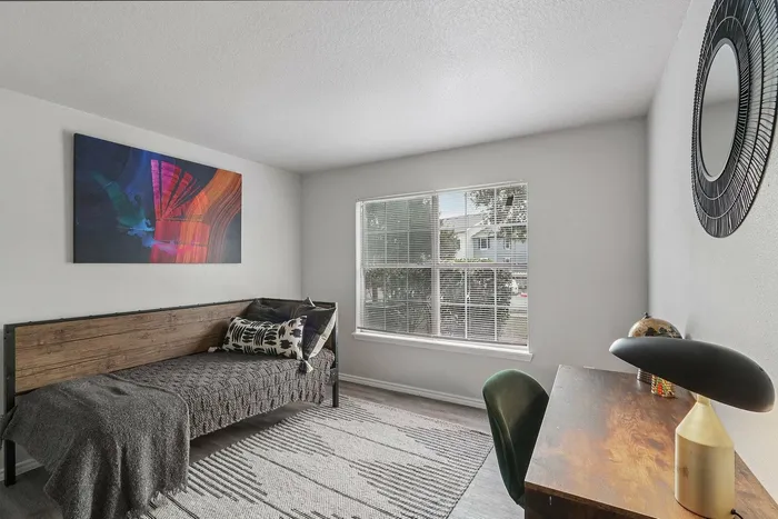 Serene bedroom with cozy ambiance at Avonmora Apartments, Austin, TX