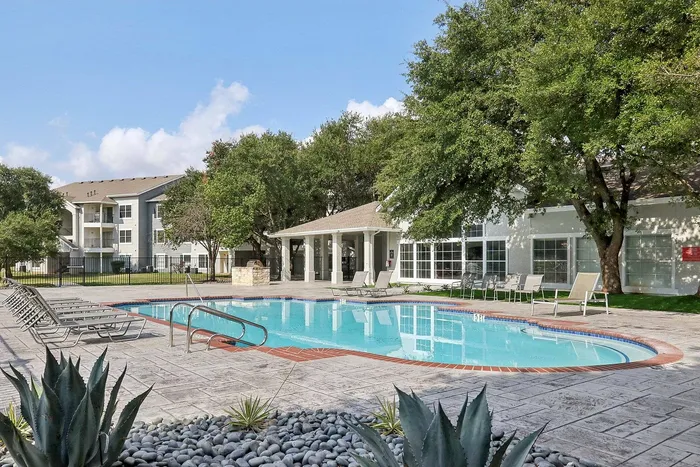 Avonmora modern apartment pool with sleek lounge furniture in Austin