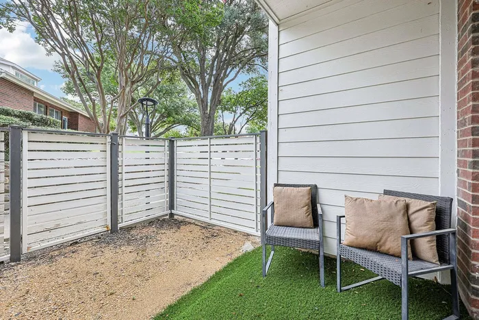 Private balcony with scenic views at Collin Creek Apartments in Plano, TX