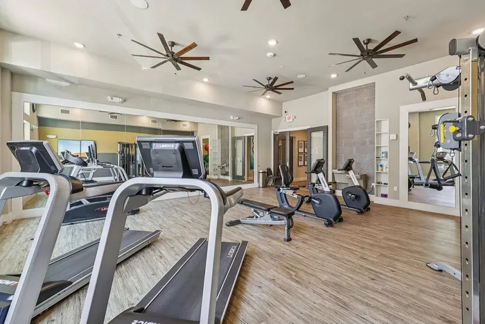 Residents working out in the McDermott 55 gym in Plano