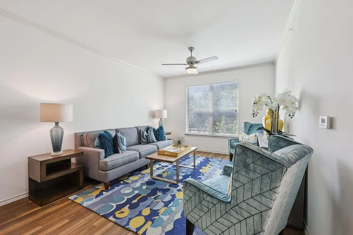 Open-concept living room in 55+ apartments at McDermott 55 Plano