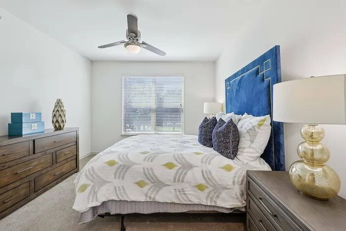 Spacious modern bedroom at McDermott 55 Apartments in Plano, TX