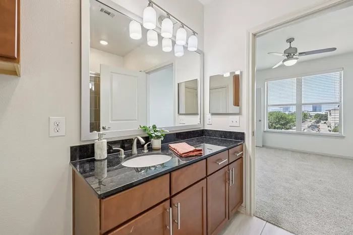 Modern bathroom with walk-in shower at McDermott 55 in Plano, TX