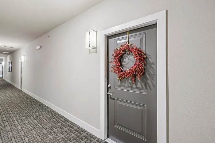 Modern front door entry at McDermott 55 Apartments in Plano, TX