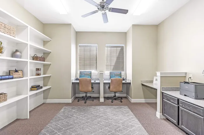 Business center at Walnut Grove Apartments in Seguin, TX, featuring computers and high-speed internet.