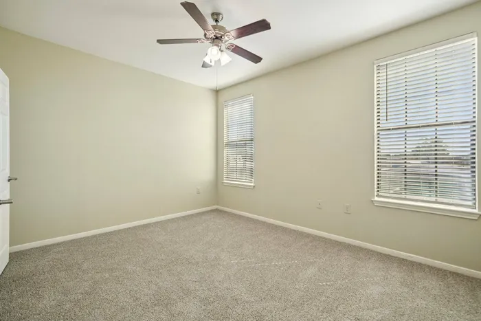Spacious bedroom with natural light at Walnut Grove Apartments in Seguin, TX