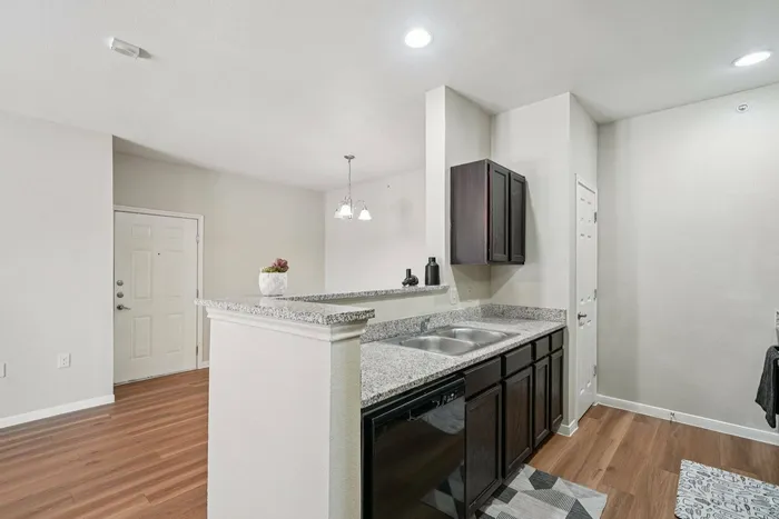 Modern kitchen and dining room at Walnut Grove Apartments in Seguin, TX