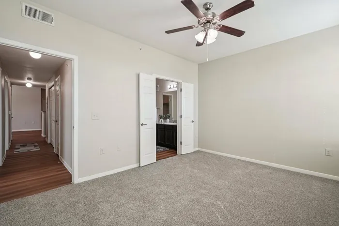 Modern bedroom with neutral tones at Walnut Grove in Seguin, TX