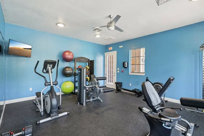 Energizing fitness center and beach entry pool with sundeck at Walnut Grove Seguin TX