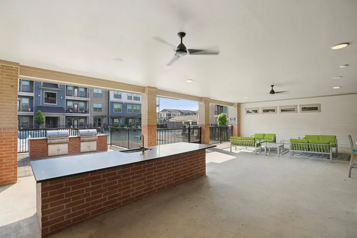 Picnic area with barbecue grills at Cityscape Apartments in Houston, TX