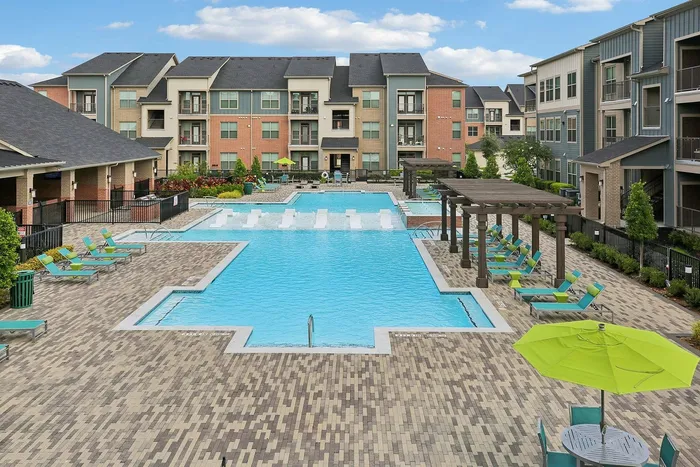 ityscape Apartments Houston shimmering pool with clear blue water