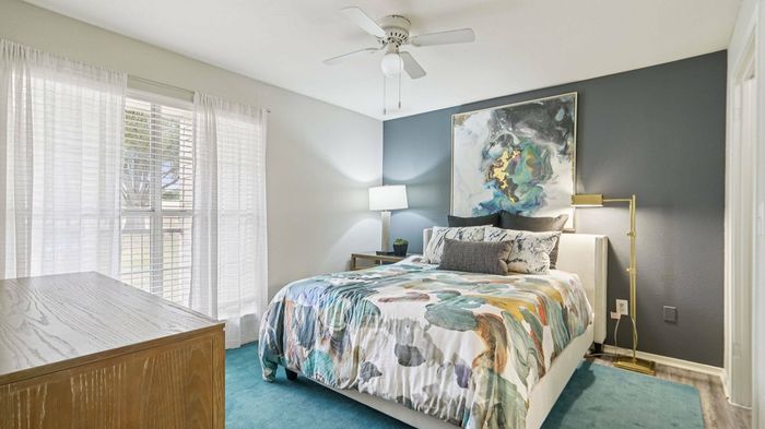Spacious bedroom with natural light at Oak Forest Apartments in Lewisville, TX