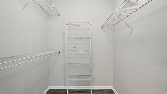 Spacious walk-in closet with ample storage at Oak Forest, Lewisville, TX
