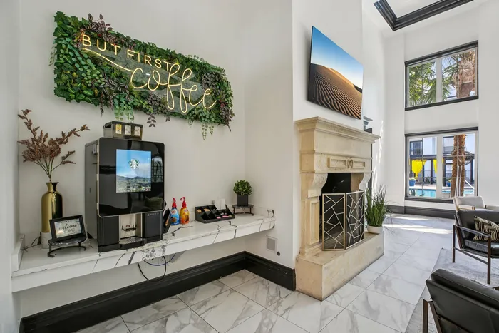 Resident coffee bar at Providence Uptown, Houston, TX, featuring cozy seating and modern design