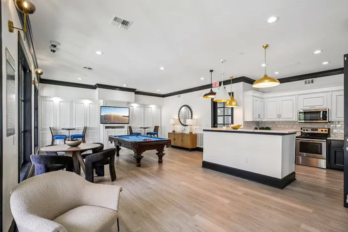 Modern social lounge with kitchen at Providence Uptown Houston