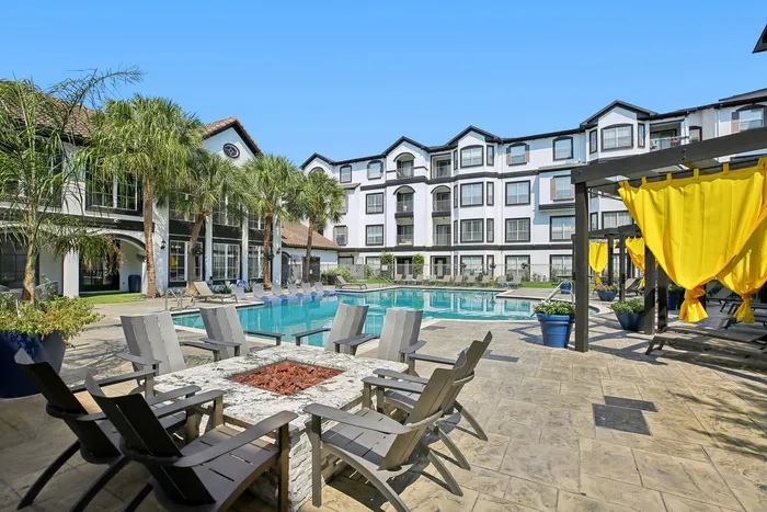 Outdoor fire pit with cozy seating at Providence Uptown in Houston, TX