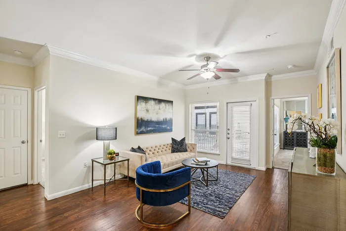 Spacious living room with plush carpet and natural light at Providence Uptown, Houston, TX