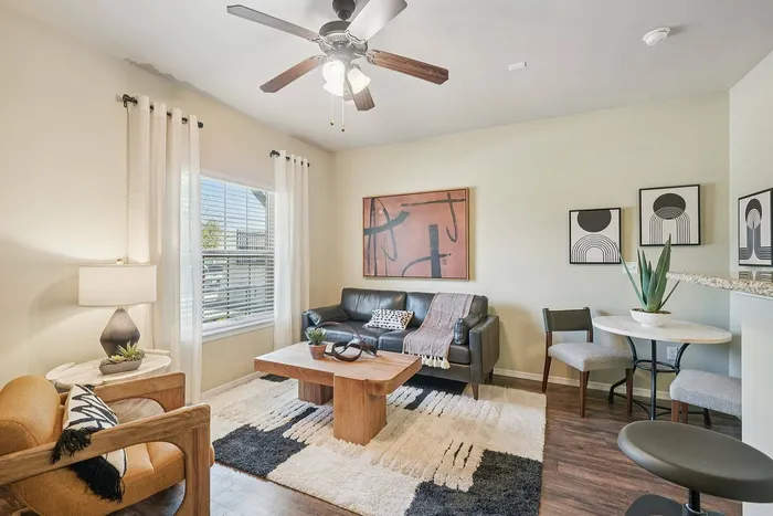 Modern living room at Arroyo Seco Villas with natural light in San Antonio, TX