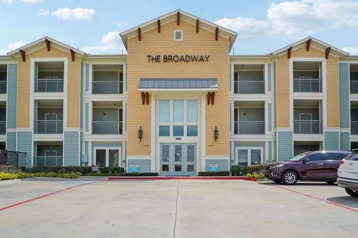 Leasing office entrance at The Broadway apartments in Houston, TX
