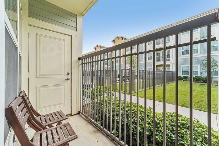 Balcony with city view at The Broadway Apartments in Houston, TX